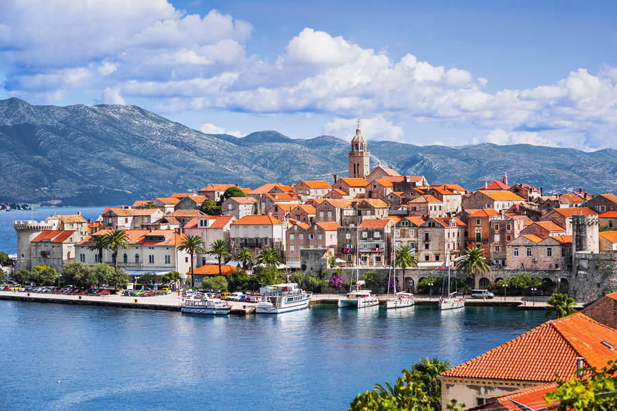 A picturesque image of Korčula's iconic city walls and harbor.