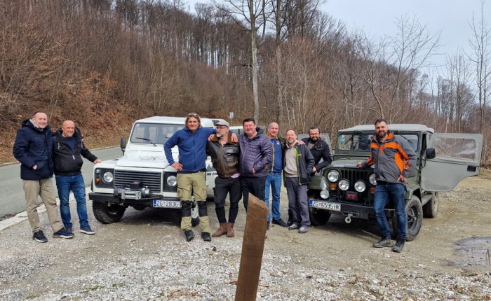 A group of off-road enthusiasts exploring the rugged terrain of Medvednica Nature Park in Croatia with their Land Rover Defenders.