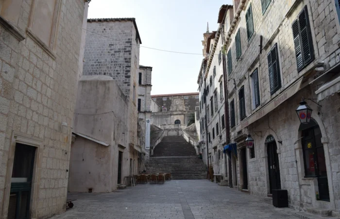 Stone street and historic staircase leading to St. Ignatius Church in Dubrovnik Old Town, Croatia - a UNESCO World Heritage site and one of Europe’s most beautiful destinations.