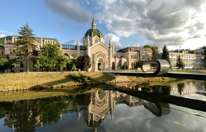 Festina Lente Bridge and the Academy of Fine Arts in Sarajevo, reflecting in the Miljacka River - one of the city’s most unique and beautiful landmarks.