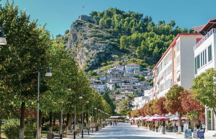 Berat’s tree-lined boulevard leads to the hillside adorned with historic Ottoman houses and the citadel atop the hill in Albania’s “City of a Thousand Windows.”