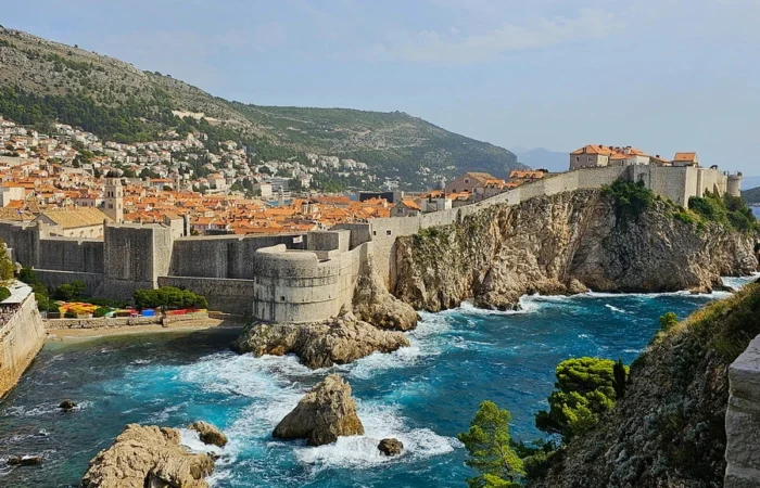 Fort Bokar towering above the sea and cliffs of Dubrovnik, showcased as Backwater Bay in Game of Thrones, with crashing waves and legendary city walls.