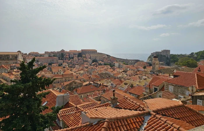 Panoramic view over Dubrovnik’s terracotta rooftops with Lovrijenac Fort in the background, featured as King’s Landing in Game of Thrones.