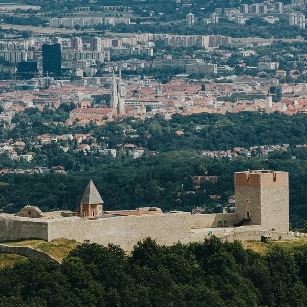 Aerial view of Medvedgrad medieval fortress on Medvednica Mountain with the city of Zagreb spread out in the background.